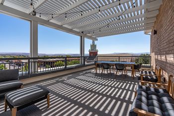 Long wooden table with chairs in pergola